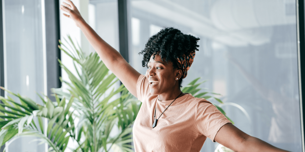 lady at work with her arms outstretched